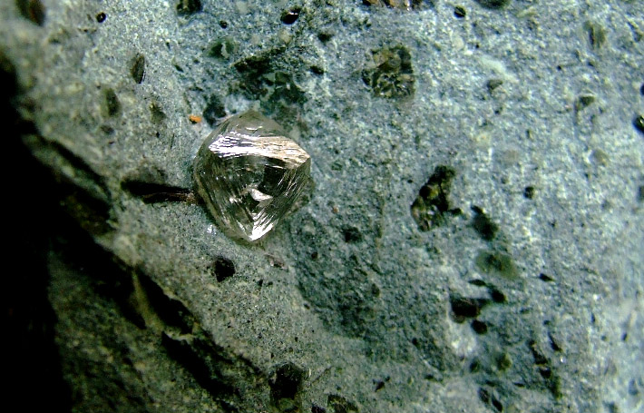 Natural crystal of diamond in kimberlite rock matrix from Finsch Mine, South Africa