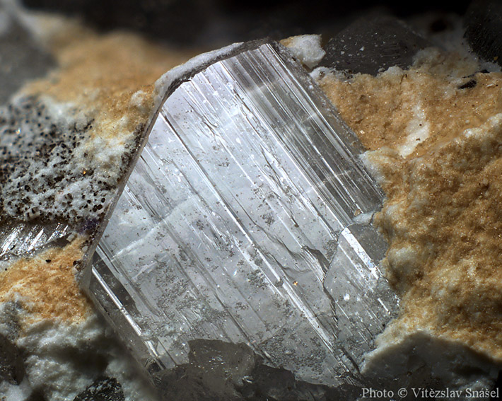Macrophoto of the small clear topaz crystal from Krupka in Czech Republic