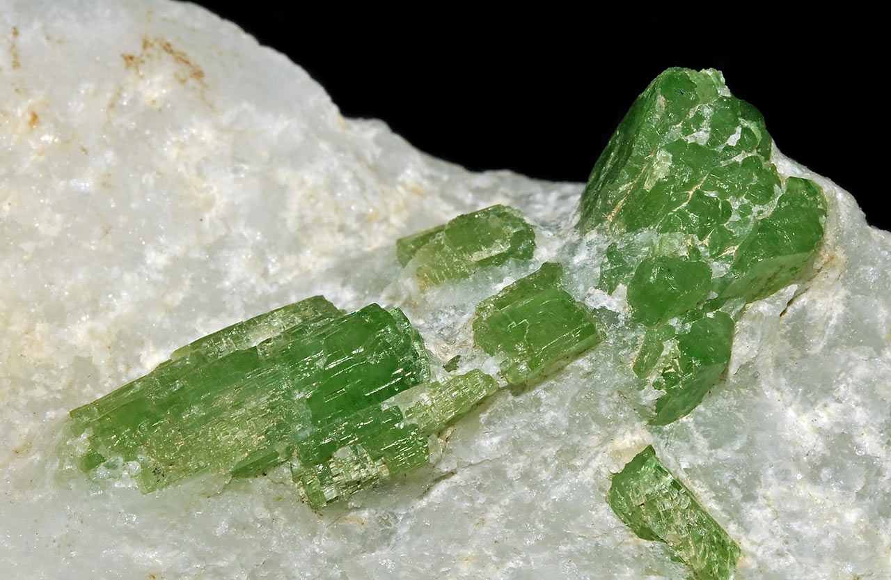 Bright green pargasite crystals in marble from Luc Yen, Yen Bai Province, Vietnam