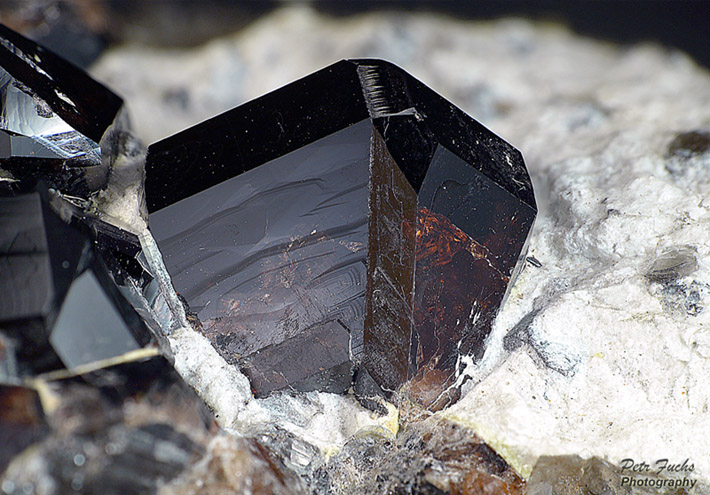 Twinned crystal of cassiterite from Krupka, Czech Republic