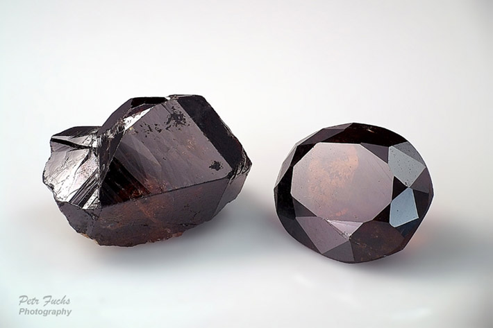 Gemmy cassiterite crystal and faceted cassiterite from Krupka, Czech Republic