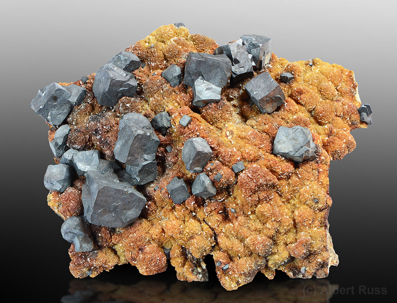 Nice galena cubes sitting on rusty colored ankerite from Romania