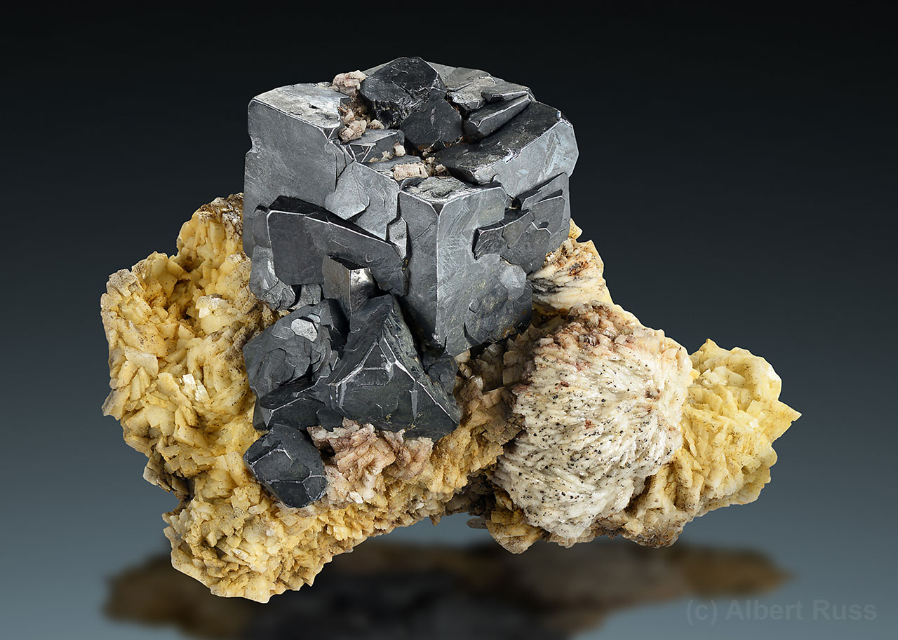 Cluster of nice cubic galena crystals with pale baryte from Bolivia