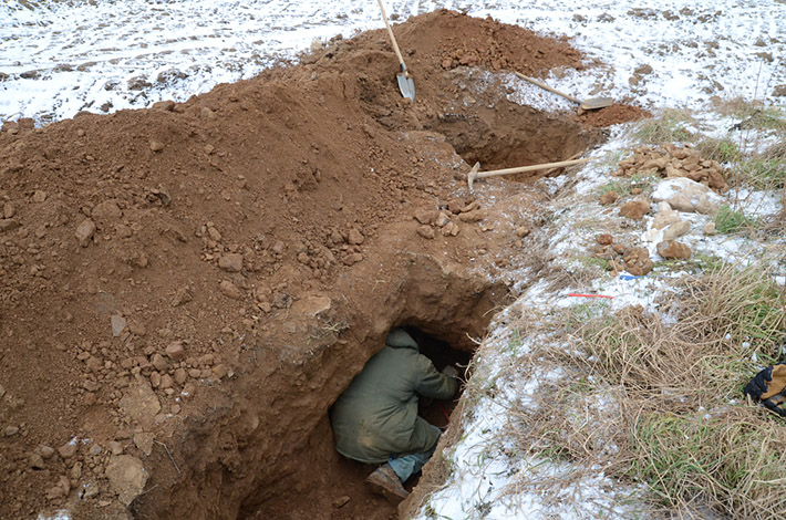 Mineral collectors digging crystals in winter