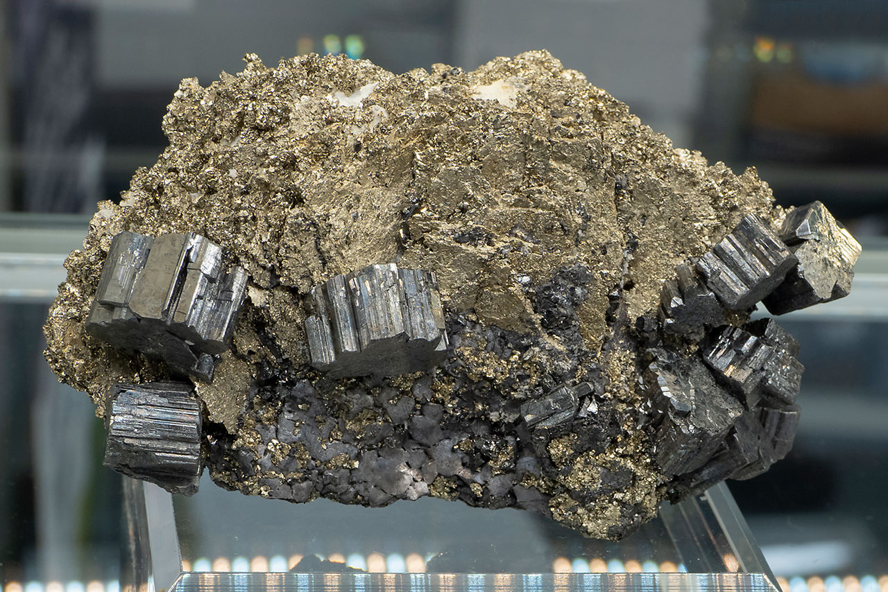 Silver bournonite crystals on golden pyrite from Trepča, Kosovo