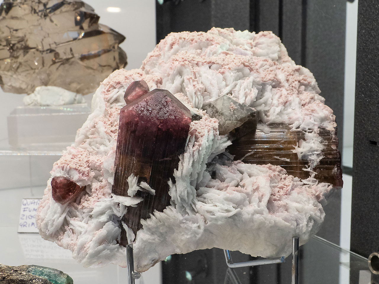 Pink lithium tourmalines on pale albite matrix from Malkhan, Russia