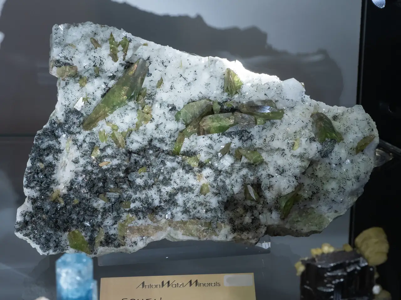 Typical green titanite (var. sphene) crystals on matrix from Gilgit, Pakistan.