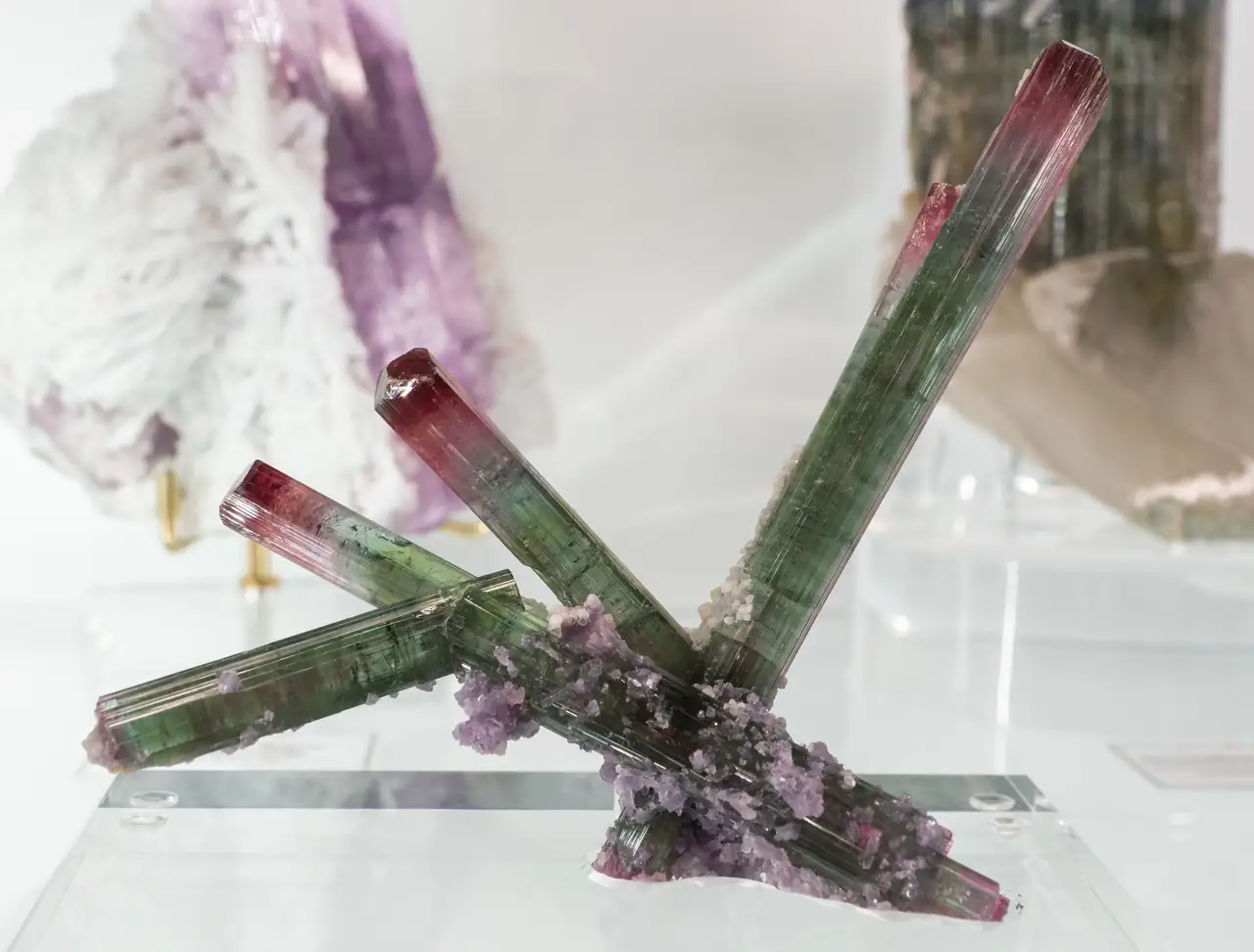 Green tourmaline with red terminations and little pink lepidolite from Cruzeiro Mine, Minas Gerais, Brazil.