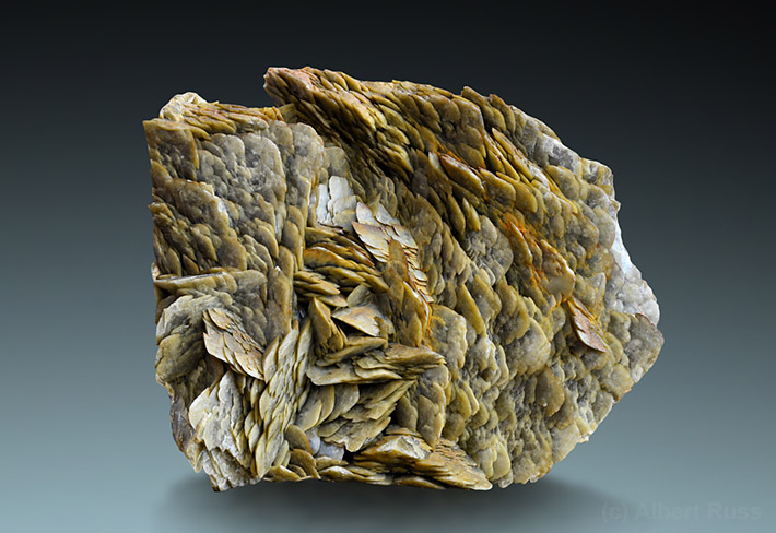 Cluster of typical pale brown flat and curved siderite crystals from Rudnany, Slovakia