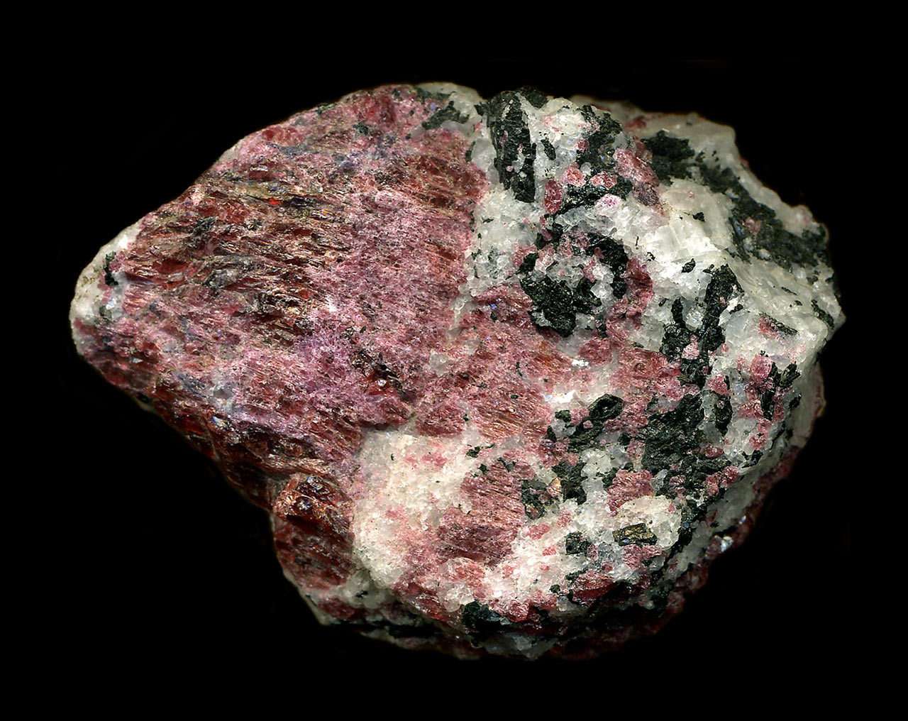 Red eudyalite with black arfvedsonite amphibole from Kipawa River, Villedieu Township, Quebec, Canada