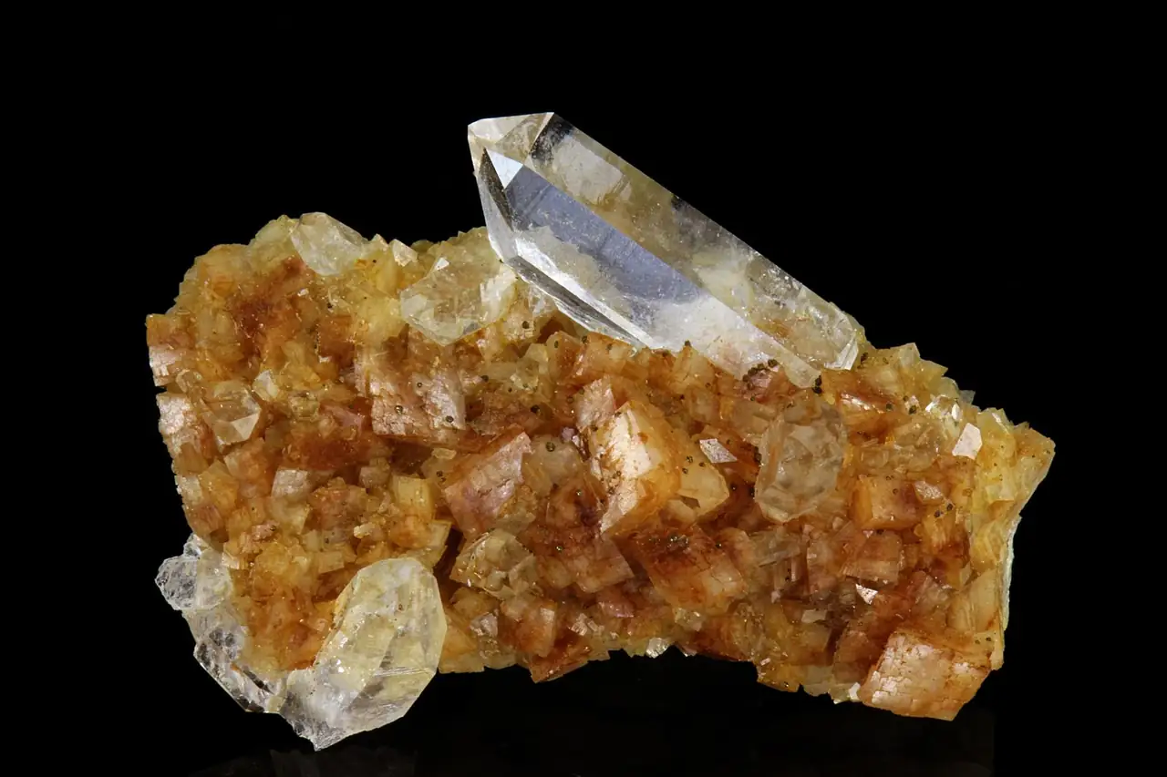 Clear quartz crystals on rusty-colored ankerite from Erzberg, Eisenerz, Steiermark, Austria.