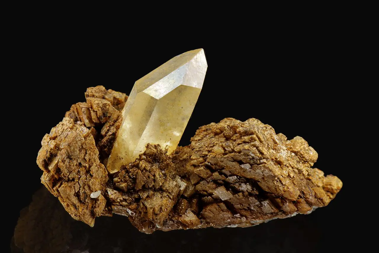 Quartz crystal on brown ankerite crystals from Erzberg, Eisenerz, Steiermark, Austria.