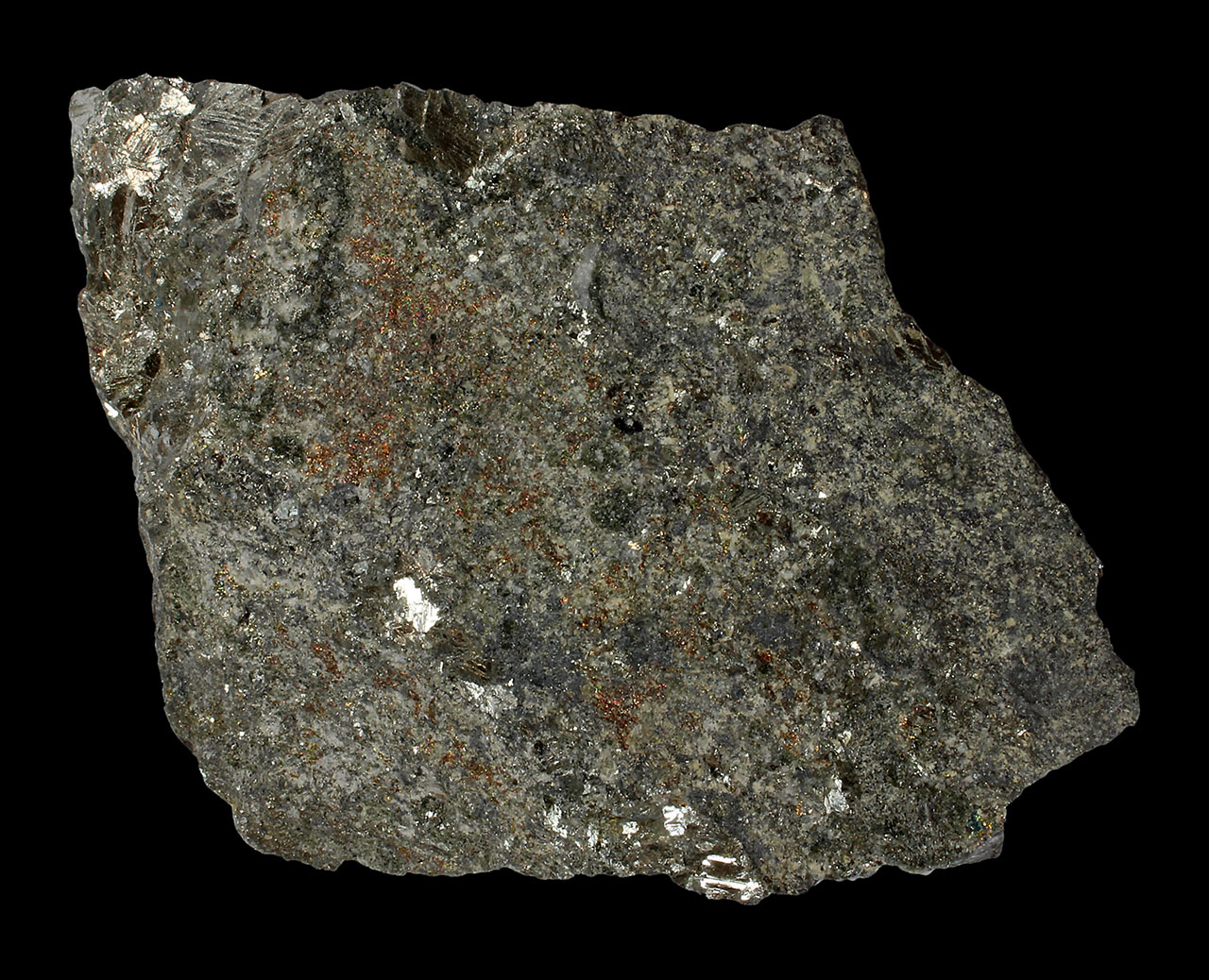 Shiny grains of native antimony with irridescent pyrite from Routakallio Quarry, Seinäjoki, Finland