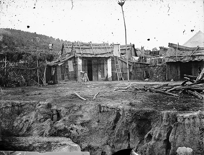 Historic photo of gold digger's bark huts in Chinatown, Tambaroora, NSW, Australia