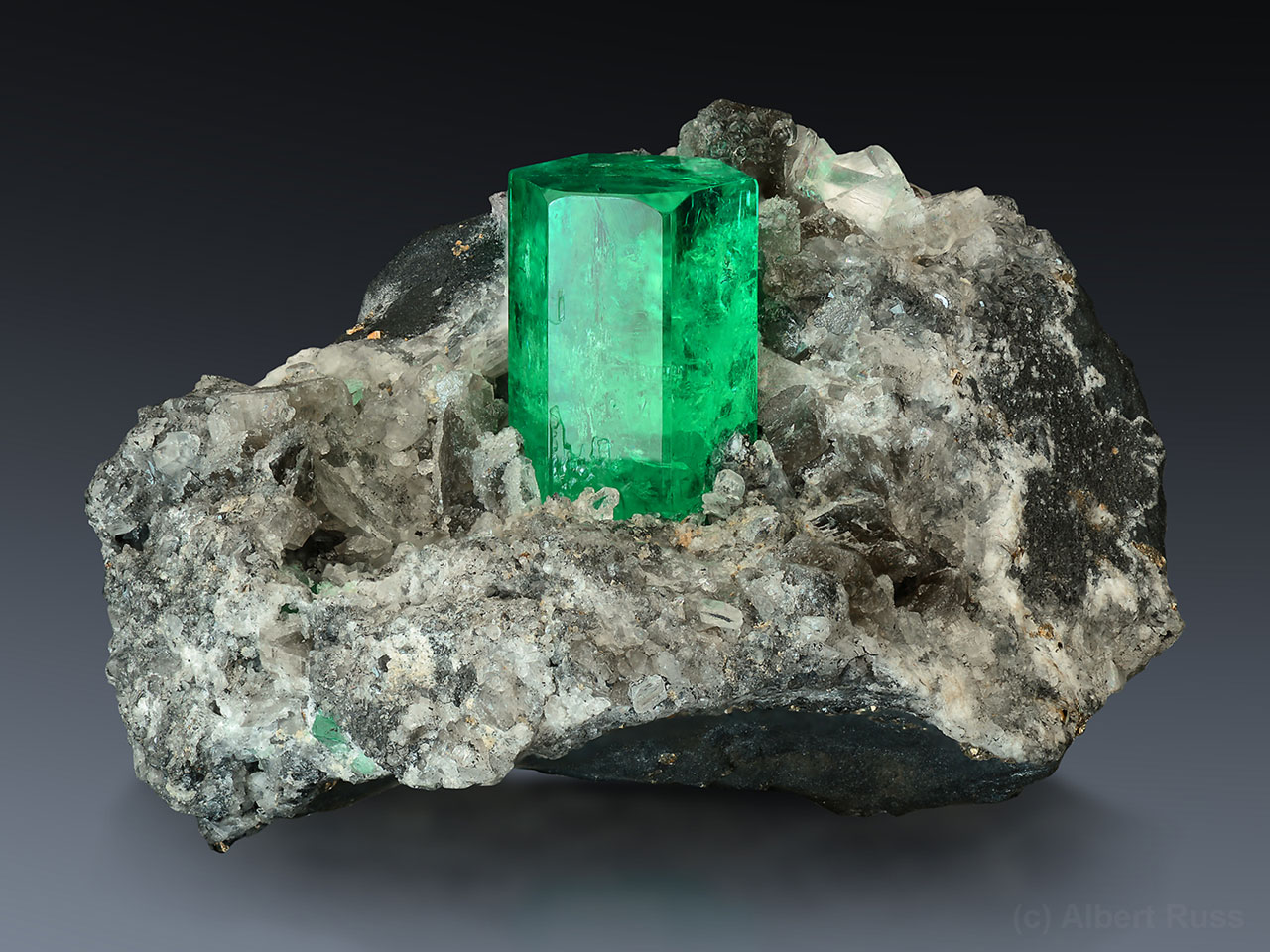 Bright colored gemmy emerald crystal on matrix from Coscuez Mine, Colombia
