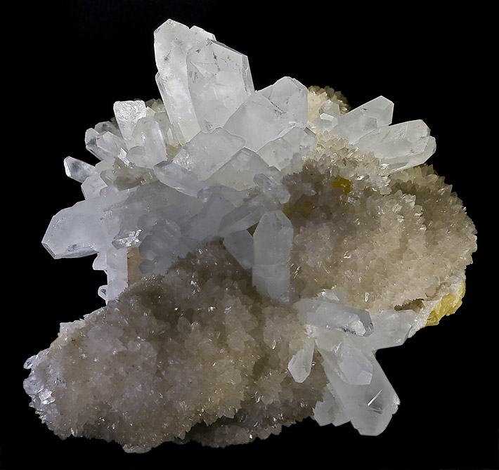 Elongated white celestine crystals on white aragonite and yellow sulphur from Miniera Florestella, Sicily, Italy