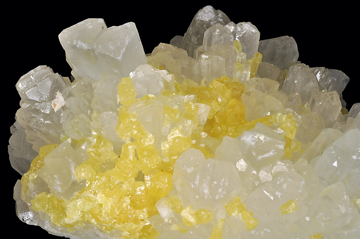 White celestine crystals with yellow sulphur from classic locality in Agrigento, Sicily, Italy