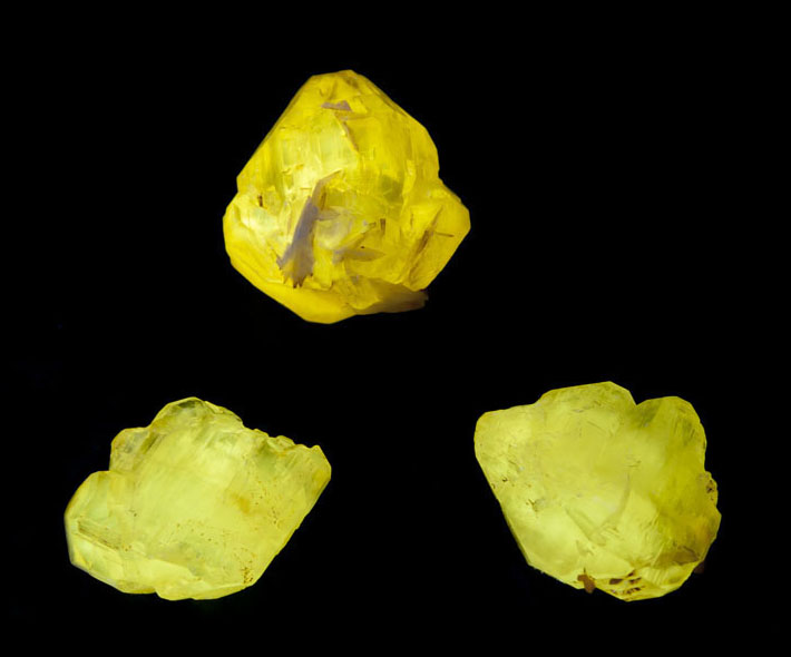 Cerussite crystals from Mibladen, Morocco showing bright yellow fluorescence in shortwave UV light