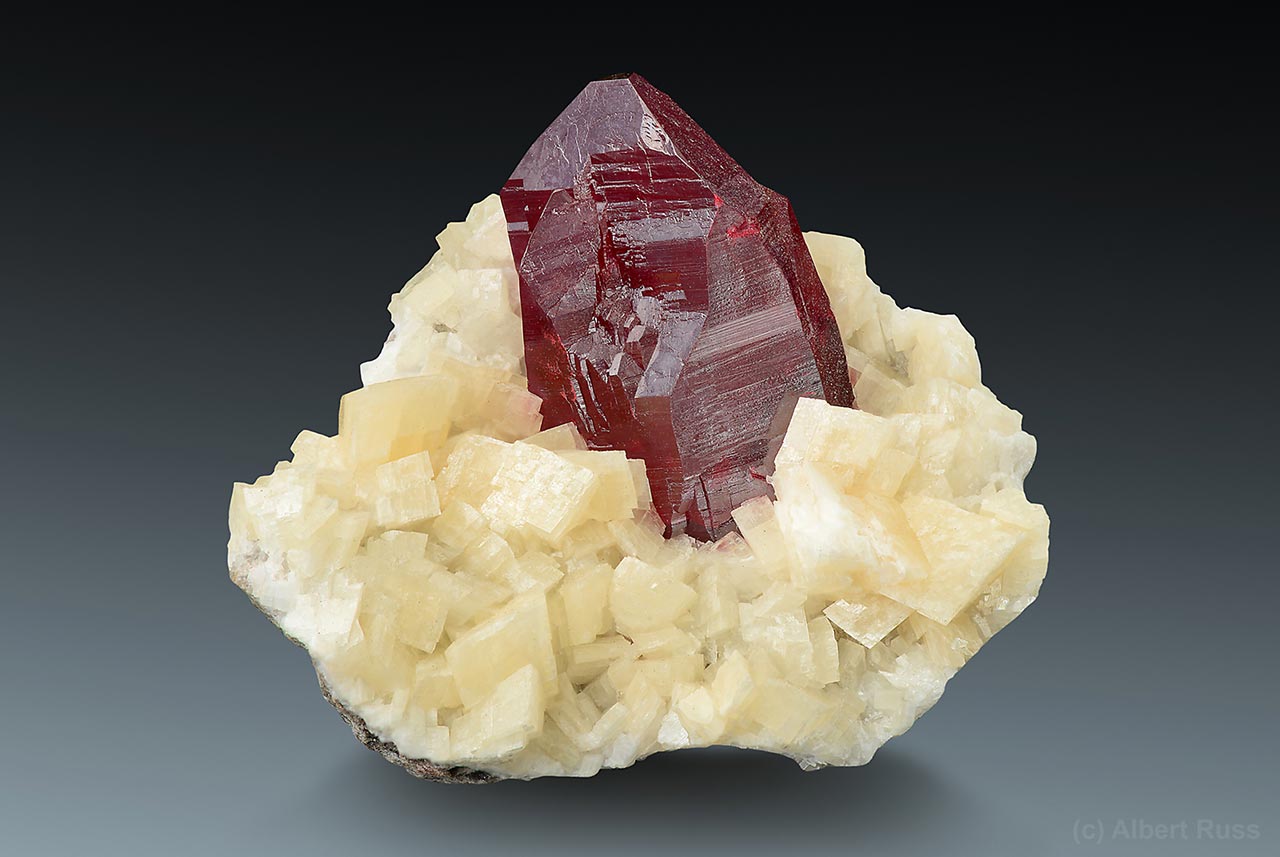 Perfect cinnabar crystal sitting on pale dolomite from Tongren Mine, China