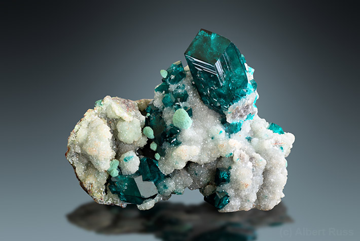 Green dioptase crystals on calcite matrix from Tsumeb, Namibia