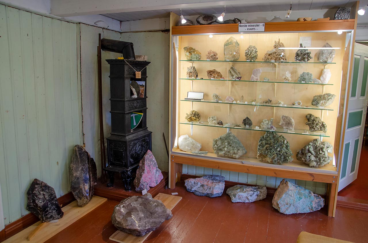 Norwegian mineral display with quartz, smoky quartz, huge thulite and amazonite.