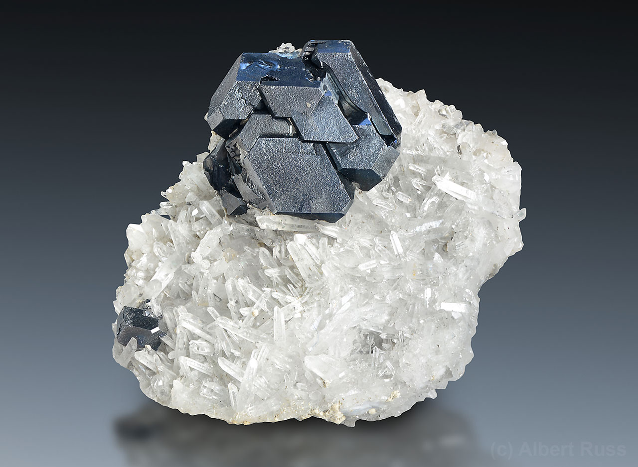 Complex galena crystal made of cube and octahedron faces sitting on quartz cluster, Dalnegorsk, Russia
