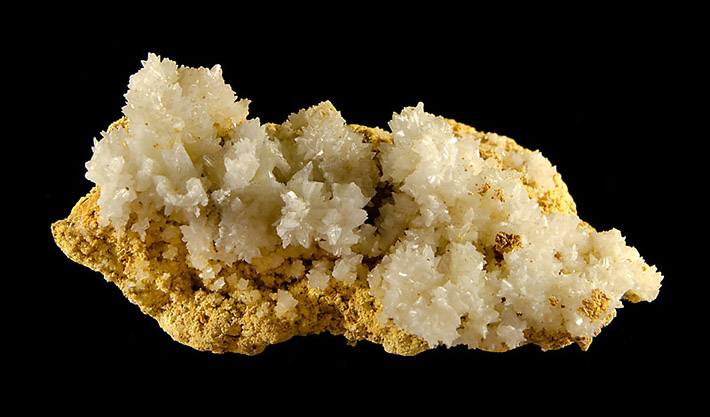 Cluster of small white crystals of gypsum from Vaclav adit in Kremnica, Slovakia
