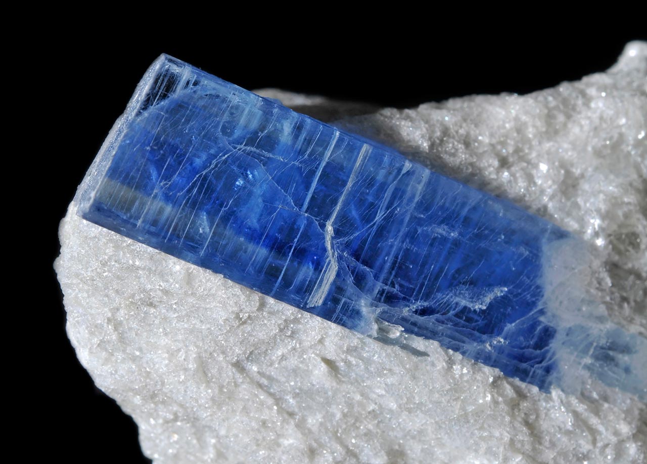 Gemmy and zoned blue crystal of kyanite in typical white paragonite matrix from Pizzo Forno, Switzerland
