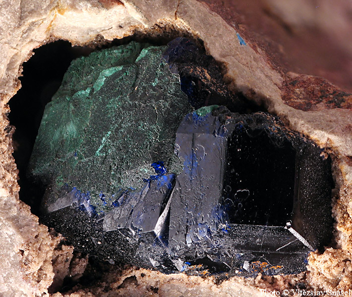 Blue azurite crystals partially pseudomorphed by green malachite from Kerrouchen, Morocco