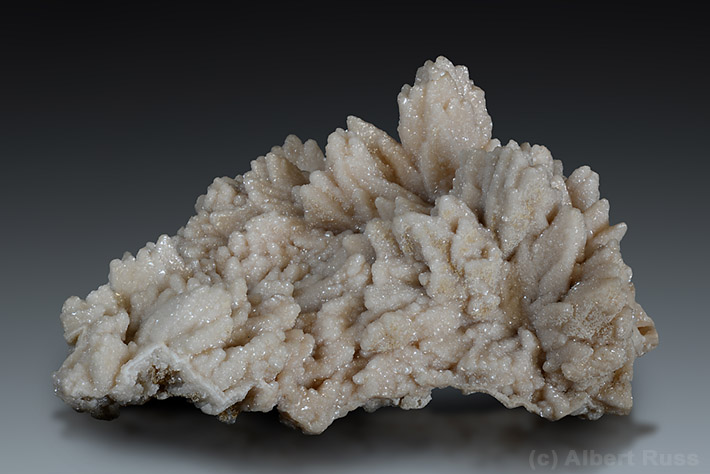Cluster of manganoan calcite crystals from Banská Štiavnica, Slovakia