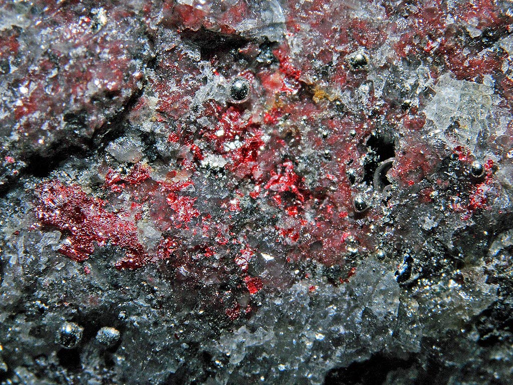Elemental mercury globules with red cinnabar from New Idria Mine, California, USA