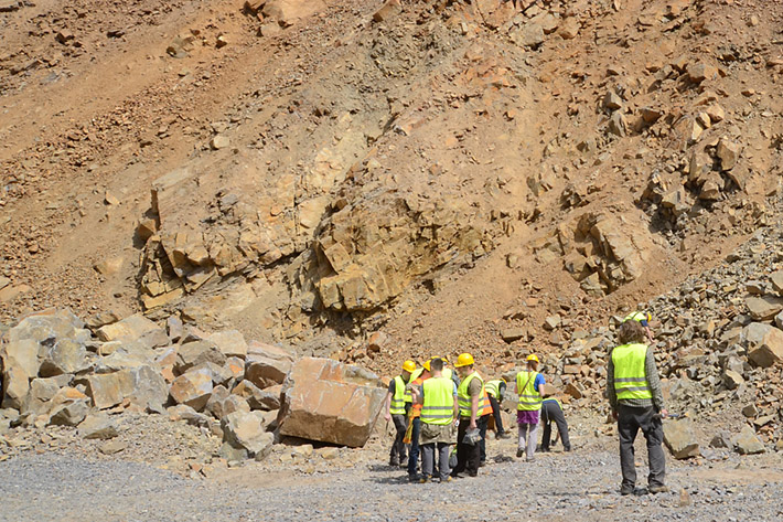 Geology field excursion with bright colored safety vests