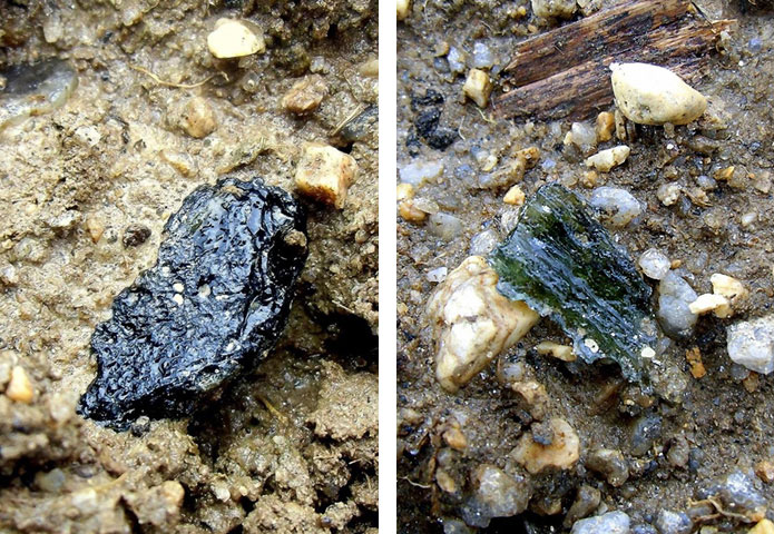 Moldavites in the soil on the field near Něchov, South Bohemia, Czech Republic