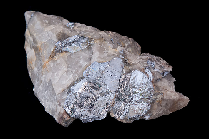 Big flakes of molybdenite in common quartz vein from Vrchoslav in Czech Republic
