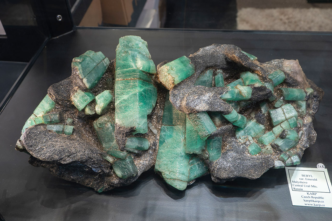 Huge mineral specimen with numerous large emerald crystals in schist matrix from Malyshevo, Russia
