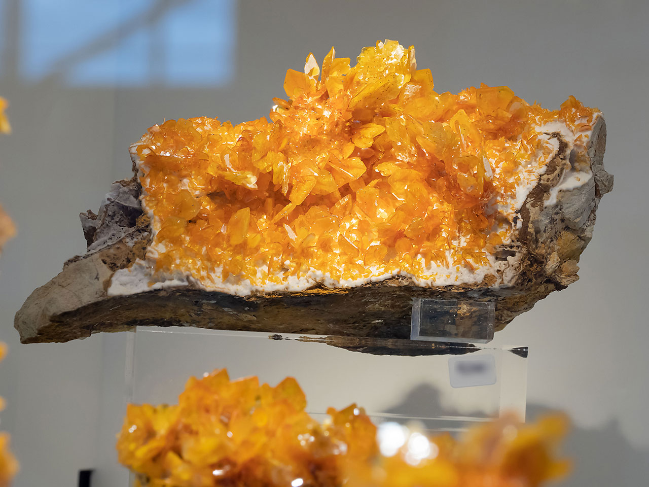 Tabular bright yellow-orange wulfenite crystals from Ahmad Abad Mine, Bafq Co., Yazd Province in Iran