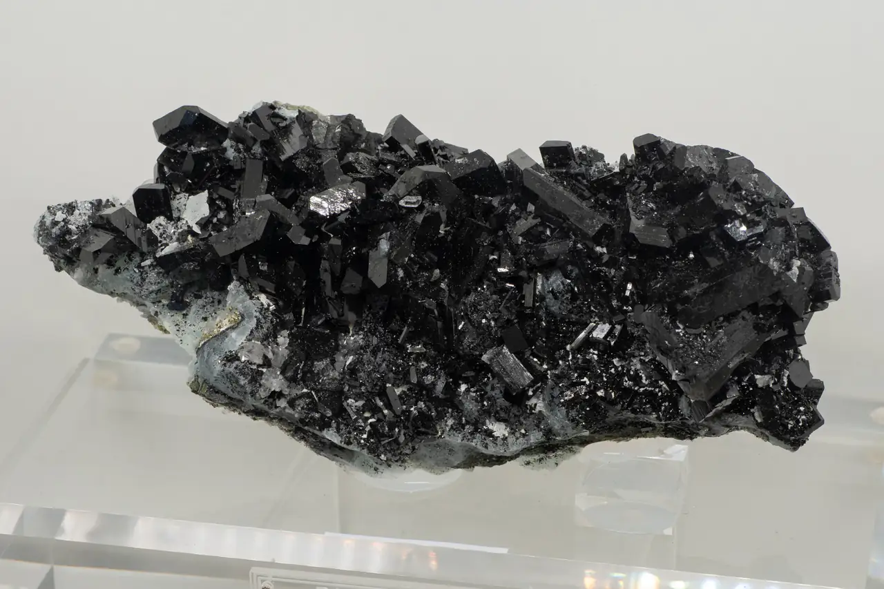 Rich cluster of dark babingtonite crystals from Qiaojia, Yunnan, China.