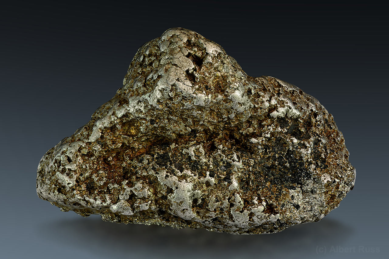 Native platinum nugget with dark gray chrome spinel from Konder, Khabarovsk, Russia