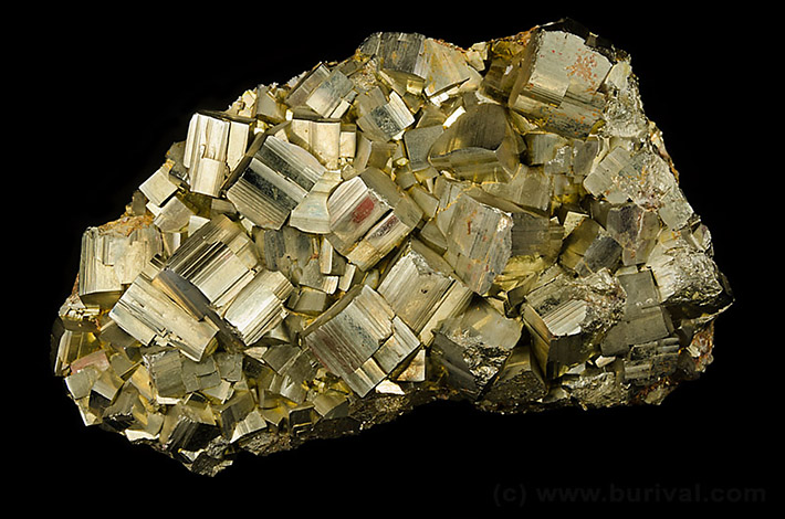 Cluster of striated pyrite cubic crystals from Rio Marina, Elba island, Italy