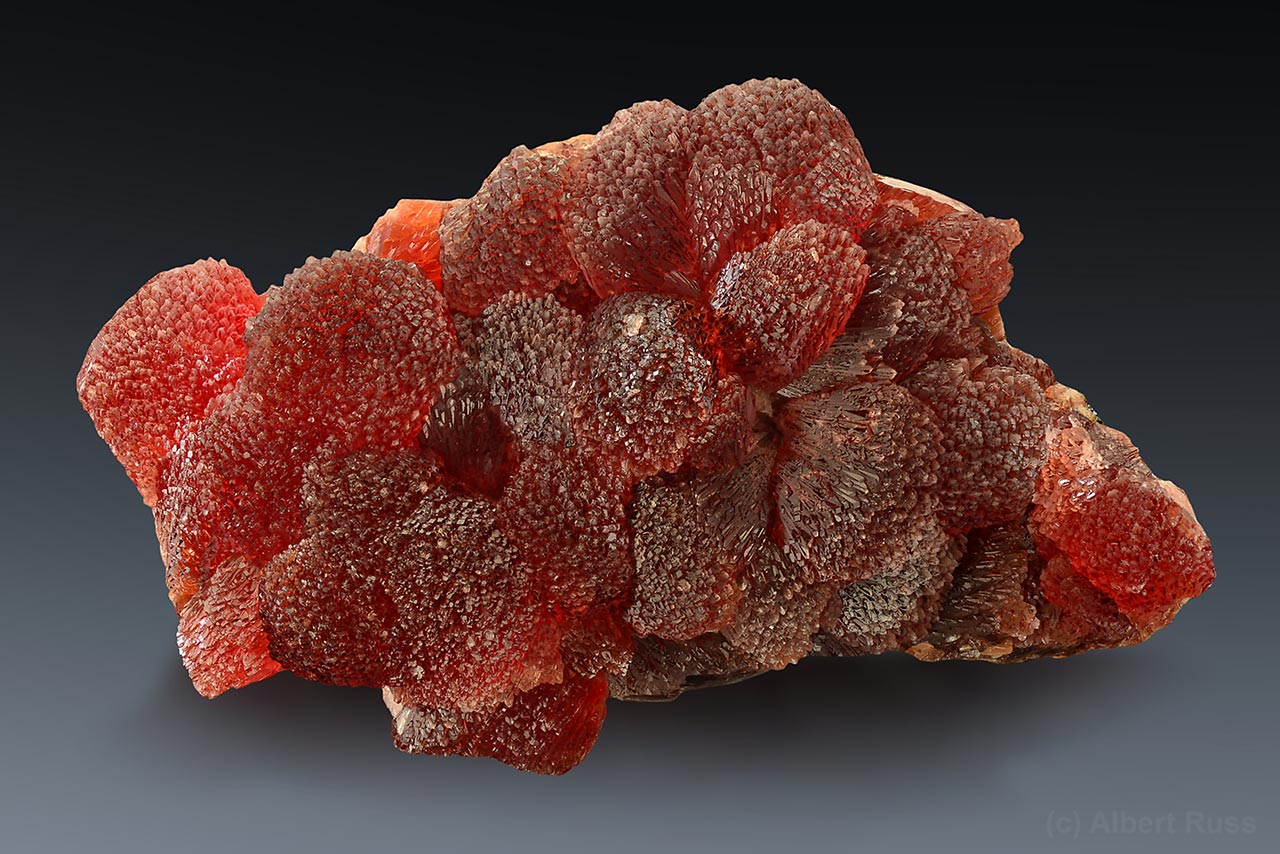 Cluster of deep red elongated crystals of rhodochrosite from N'Chwaning, Kalahari Manganese Fields, South Africa