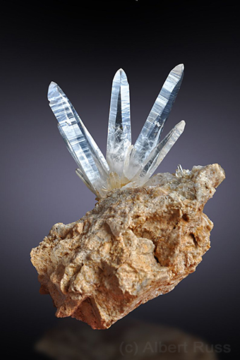 Group of thin long clear quartz crystals from Sobov in Slovakia