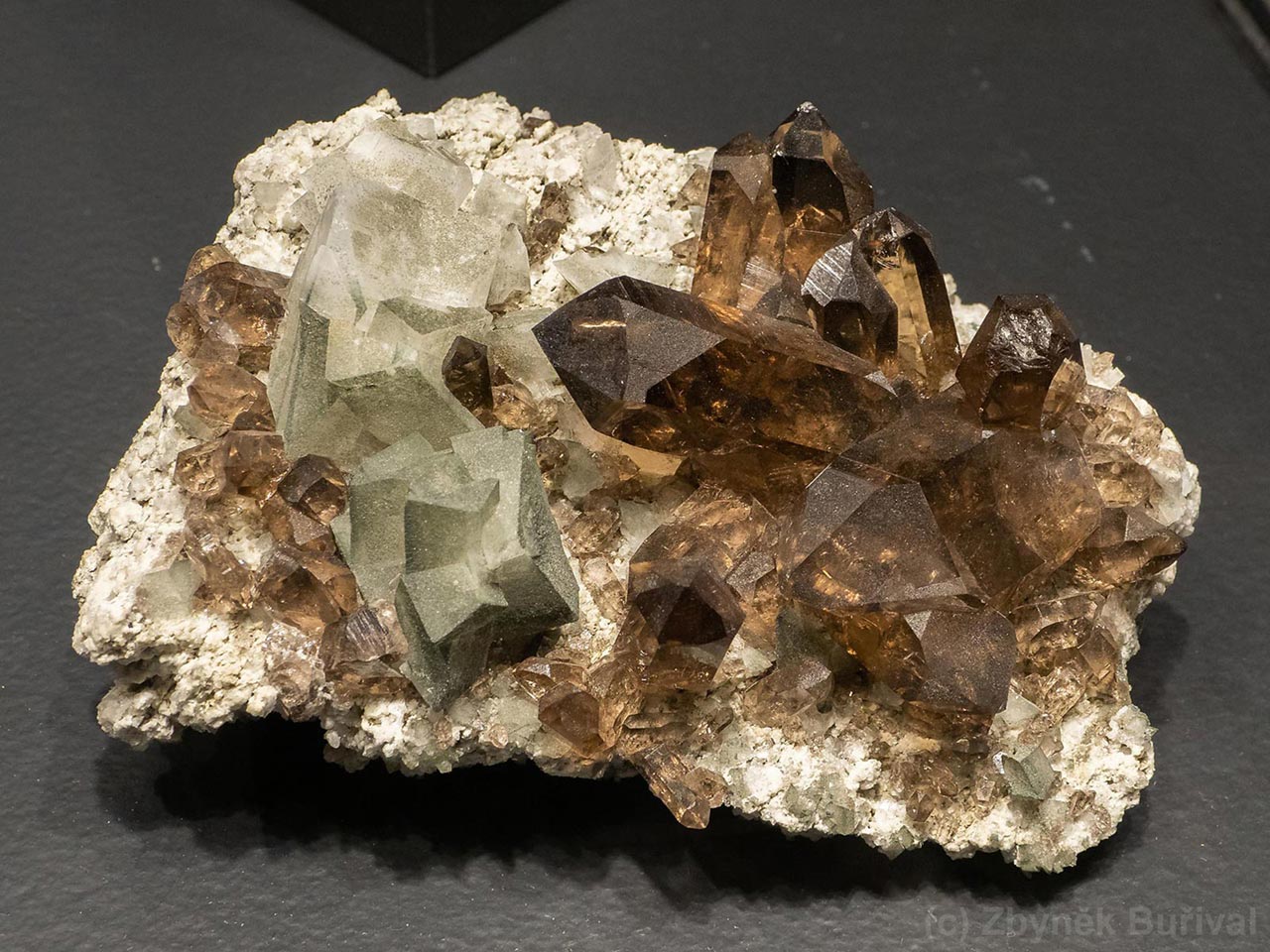 crystal cluster of gemmy smoky quartz with adularia from Galmihorn, Switzerland