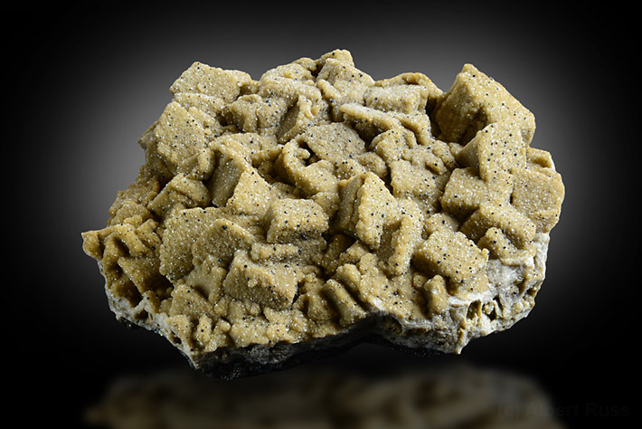 Cluster of pale brown siderite crystals pseudomorphing calcite from Turt, Romania