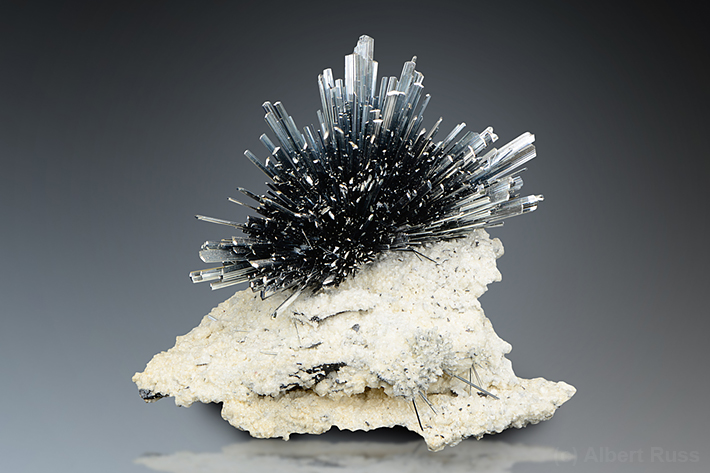 Fan of stibnite crystals on matrix from Romania