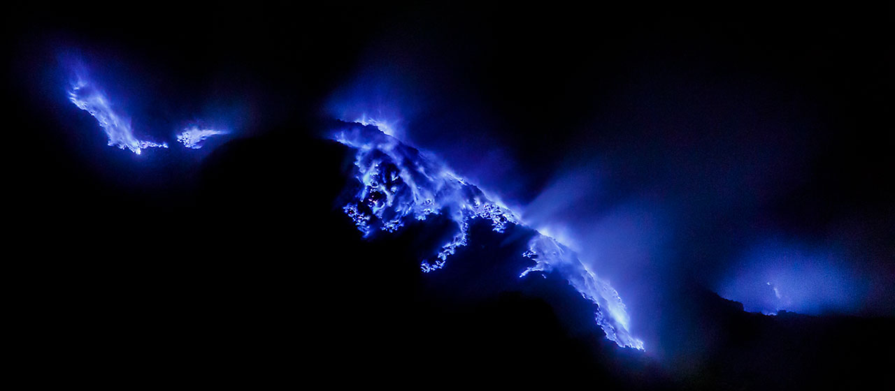 Burning sulphur at night at Kawah Ijen volcano, Java, Indonesia