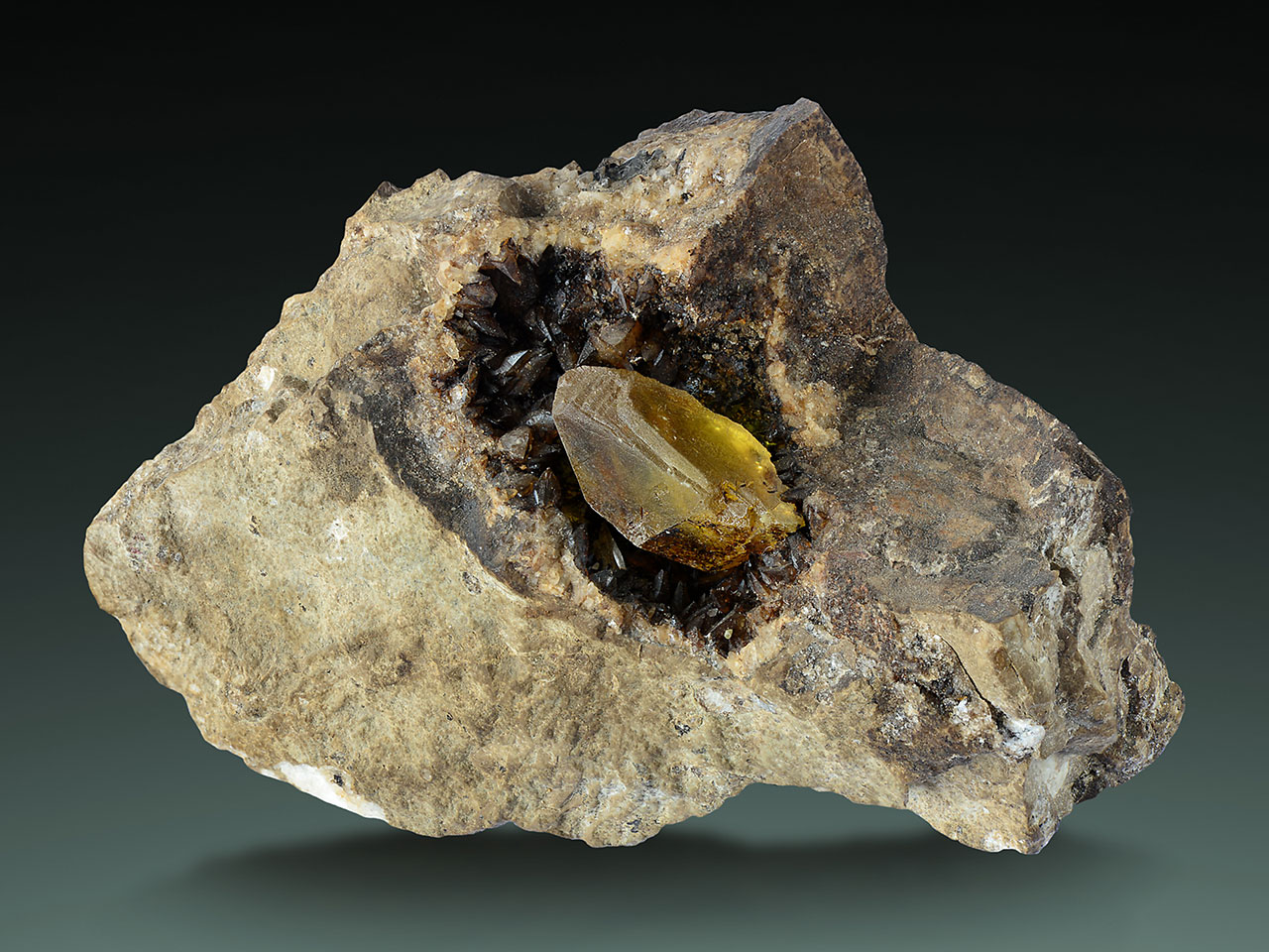 Sulphur crystal in small calcite vug from Samara, Russia