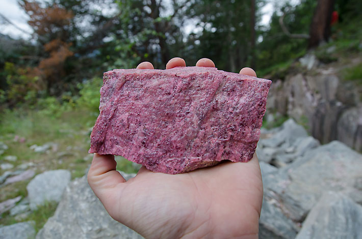 good quality pink thulite with dark grains of piemontite