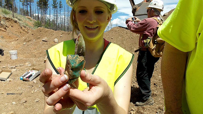 Krystle Dorris holding amazonite and smoky quartz from Colorado
