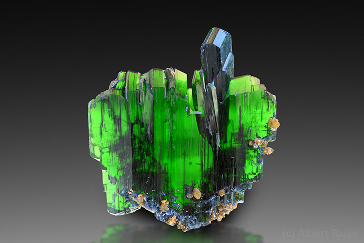 Bright green multiple twinned crystals of vivianite from Oruro department, Bolivia