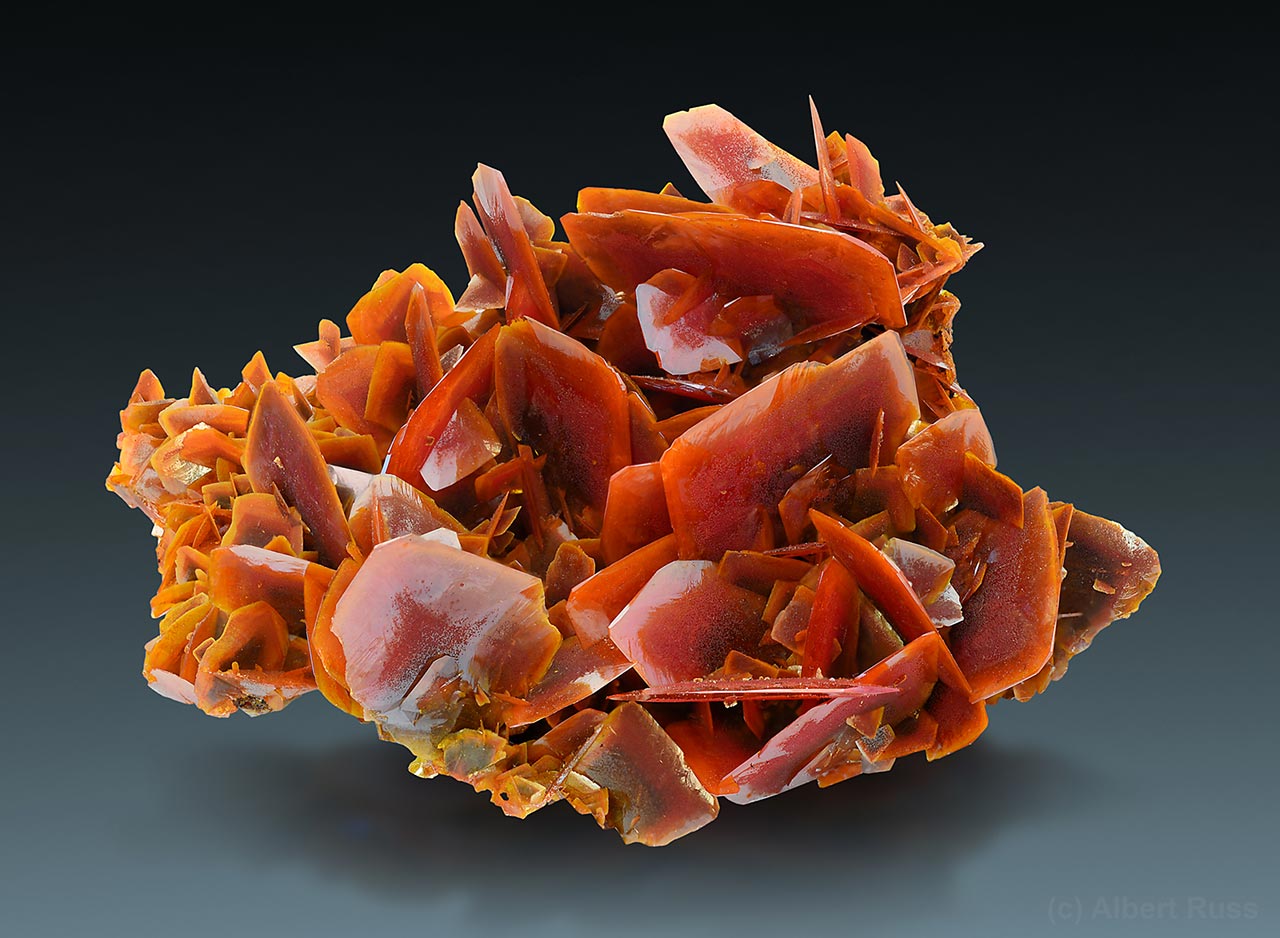 Cluster of flat deep orange crystals of wulfenite from Jianshan Mine, Xinjiang Autonomous Region, China